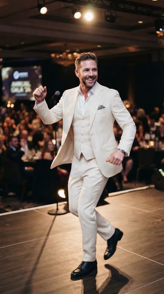 Original photo of a man in a white suit at a corporate event, before AI dance generation